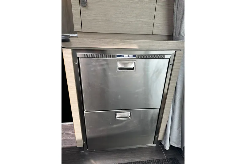 Slide: The Image of Stainless steel refrigerator in 2020 Fountaine Pajot Astrea 42 Catamaran interior. - 40