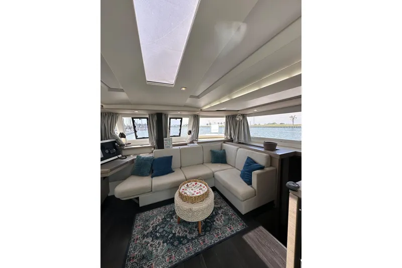 Slide: The Image of Luxurious interior of 2020 Fountaine Pajot Astrea 42 Catamaran with elegant seating and panoramic windows. - 41