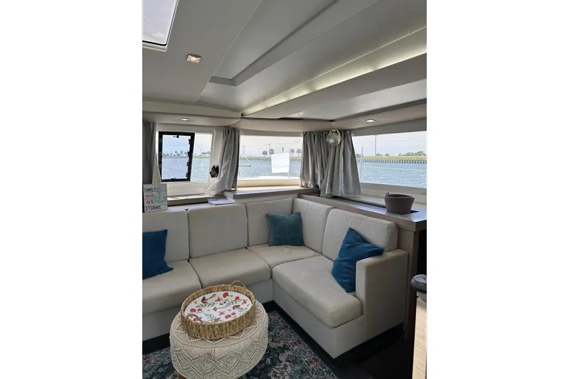 Slide: The Image of Interior of 2020 Fountaine Pajot Astrea 42 Catamaran with cozy seating and ocean view. - 42