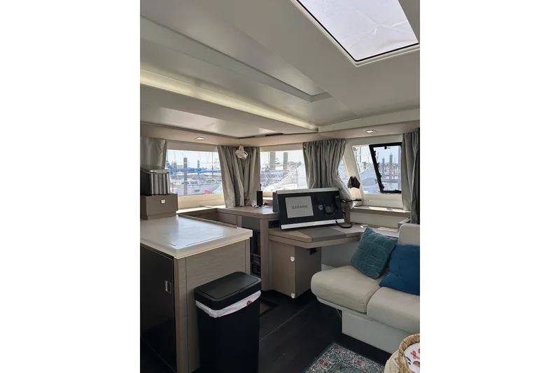 Slide: The Image of Interior of 2020 Fountaine Pajot Astrea 42 Catamaran with modern furnishings and navigation equipment. - 43
