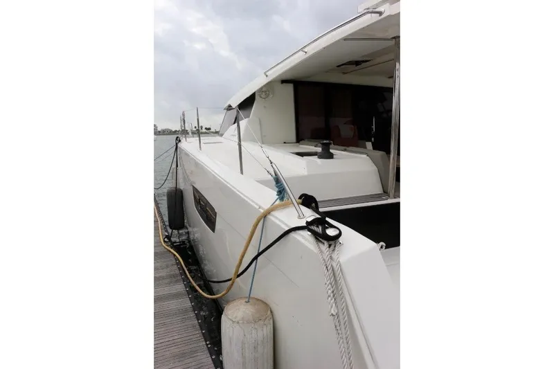 Slide: The Image of 2020 Fountaine Pajot Astrea 42 Catamaran docked, side view with mooring lines. - 5