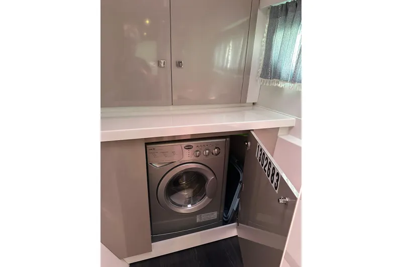 Slide: The Image of Laundry area with washing machine in 2020 Fountaine Pajot Astrea 42 Catamaran. - 66