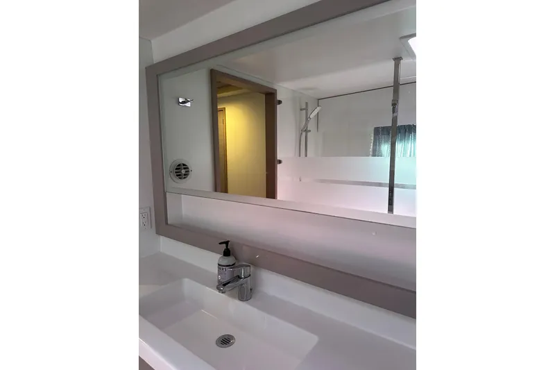 Slide: The Image of Modern bathroom interior of 2020 Fountaine Pajot Astrea 42 Catamaran, featuring sleek sink and mirror. - 67
