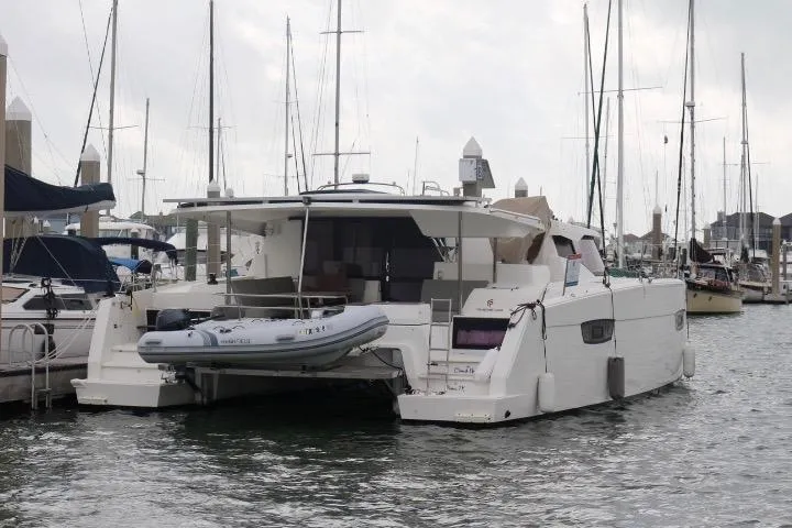 Slide: The Image of 2020 Fountaine Pajot Astrea 42 Catamaran docked in a marina, rear view. - 7