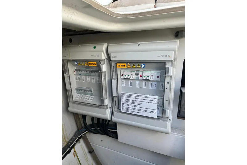 Slide: The Image of Electrical panel on a 2020 Fountaine Pajot Astrea 42 Catamaran, featuring 230V and 110V systems. - 76