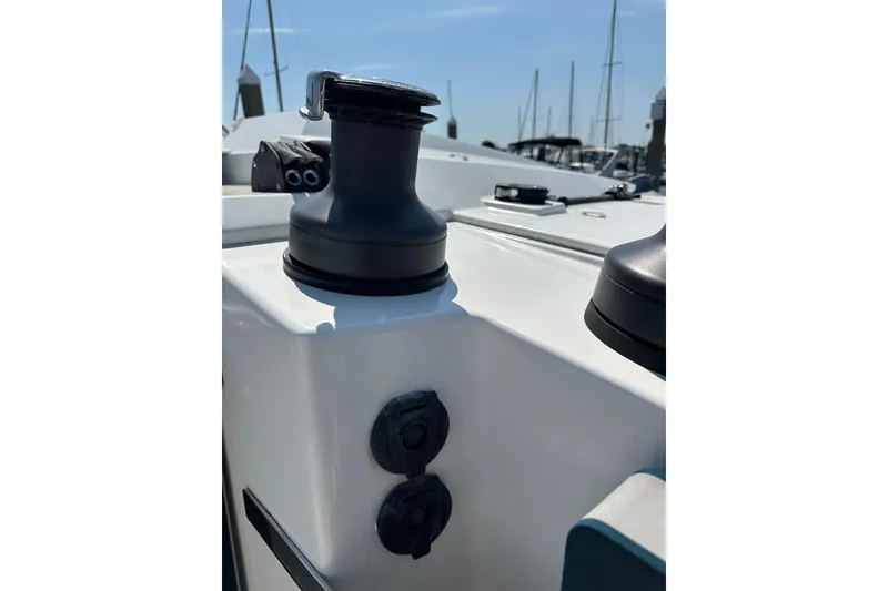 Slide: The Image of Close-up of a 2020 Fountaine Pajot Astrea 42 Catamaran deck winch in a marina. - 85