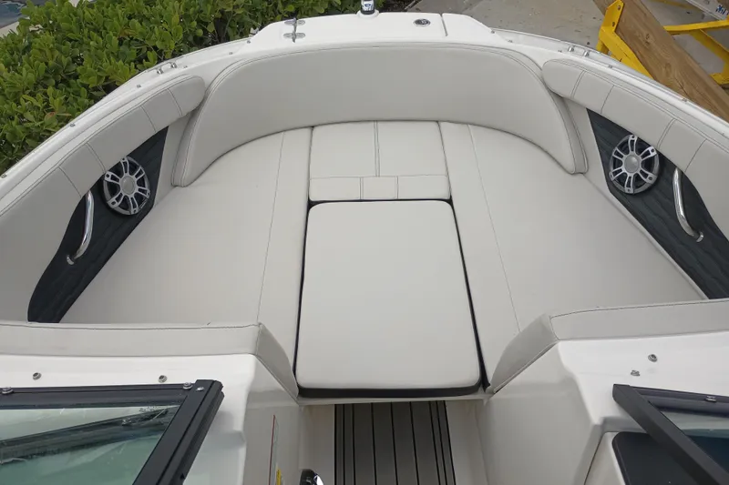 Slide: The Image of 2023 Sea Ray SPX 190 Outboard boat interior with cushioned seating and speakers. - 11