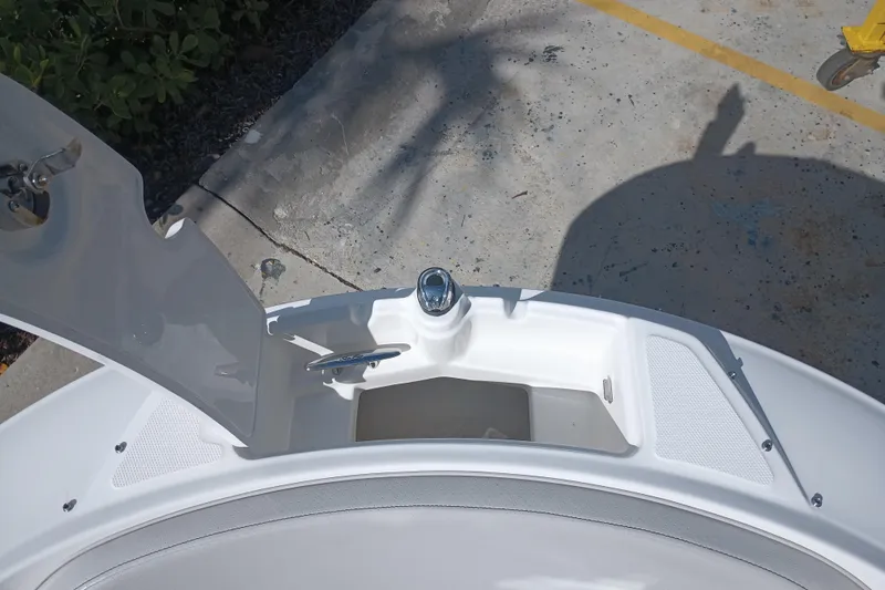 Slide: The Image of 2023 Sea Ray SPX 190 Outboard boat storage compartment with open hatch. - 13