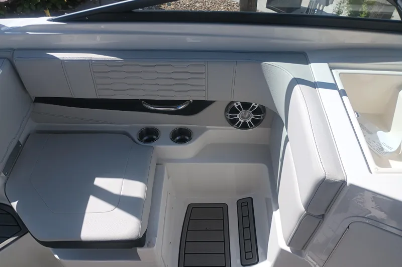 Slide: The Image of 2023 Sea Ray SPX 190 Outboard interior with seating, cup holders, and speaker. - 16