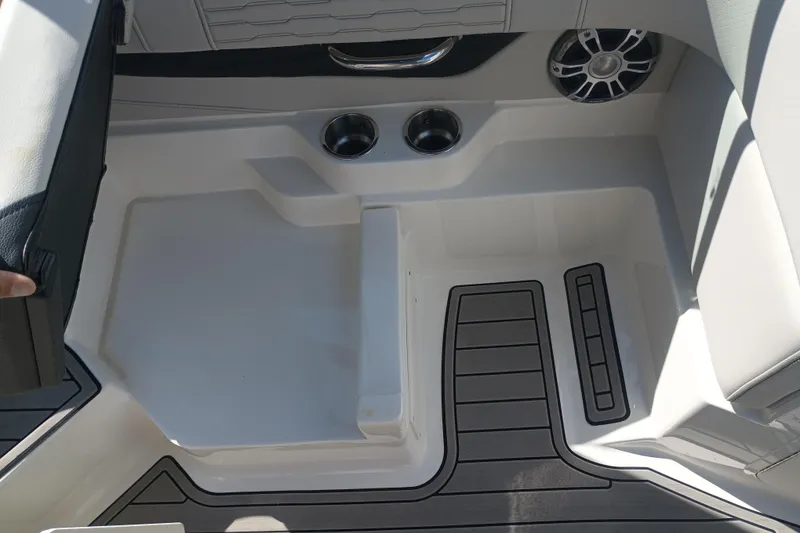 Slide: The Image of 2023 Sea Ray SPX 190 Outboard boat interior with cup holders and speaker. - 17