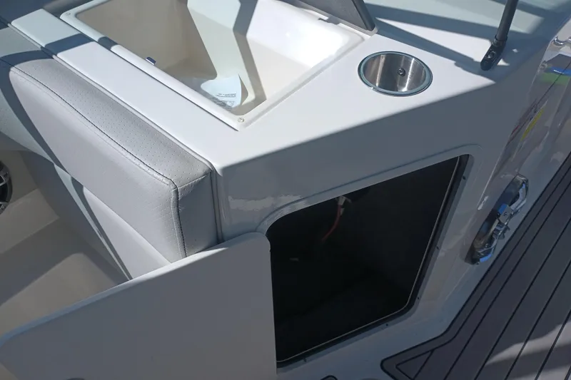 Slide: The Image of 2023 Sea Ray SPX 190 Outboard boat interior with storage compartment and seating. - 18