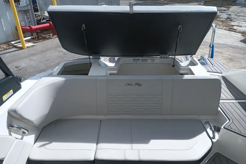 Slide: The Image of 2023 Sea Ray SPX 190 Outboard boat interior with open storage compartment. - 22