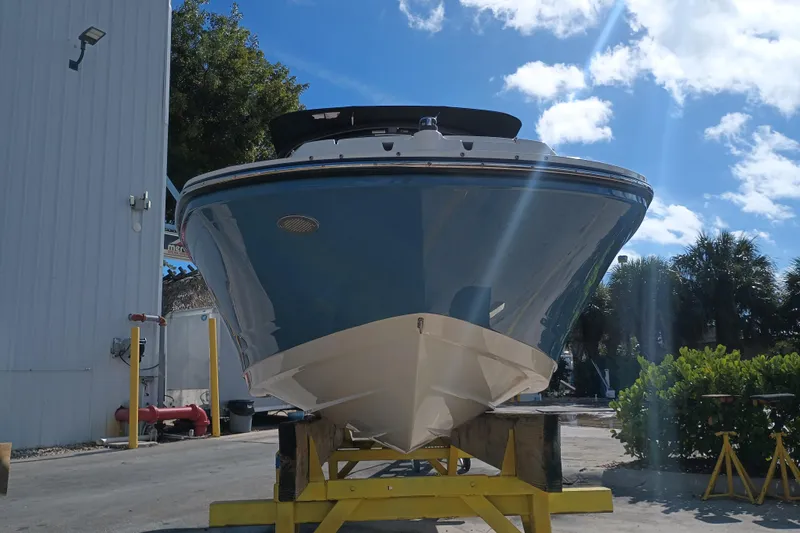 Slide: The Image of 2023 Sea Ray SPX 190 Outboard boat on a stand, sunny day, blue sky. - 3