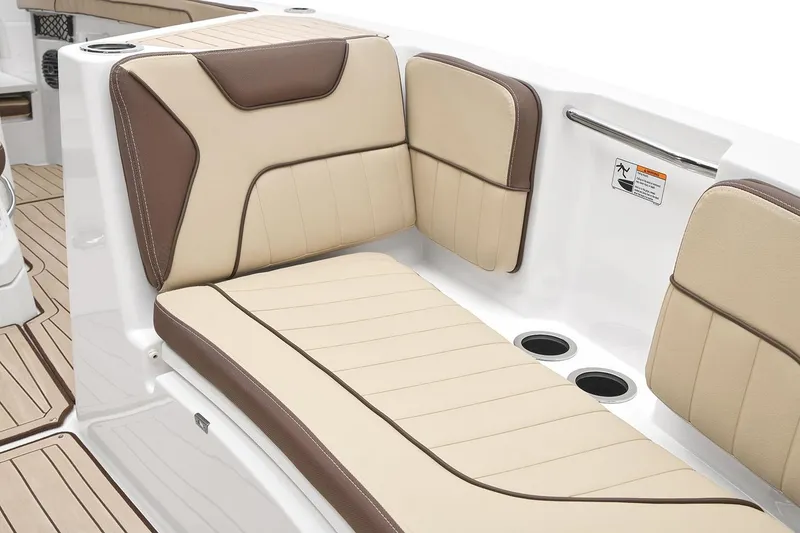 Slide: The Image of Manufacturer Provided Image: 2026 Yamaha Boats 222 FSH Sport E interior seating, featuring beige and brown cushioned design. - 8