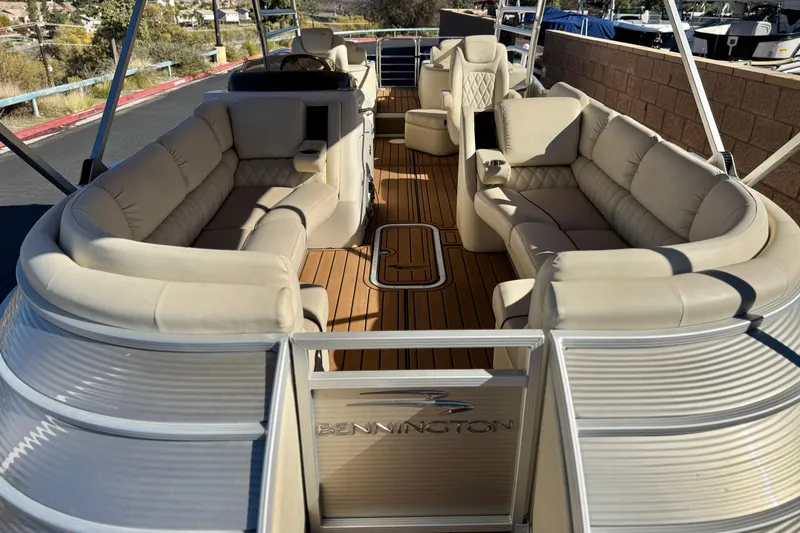 Slide: The Image of 2013 Bennington 2575QCW I/O pontoon boat with luxurious seating and spacious deck. - 12