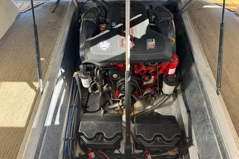 Slide: The Image of Engine compartment of a 2013 Bennington 2575QCW I/O boat, showcasing detailed mechanical components. - 29