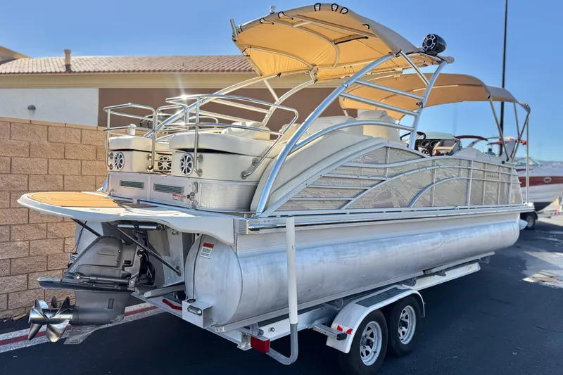 Slide: The Image of 2013 Bennington 2575QCW I/O pontoon boat with canopy on a trailer. - 6