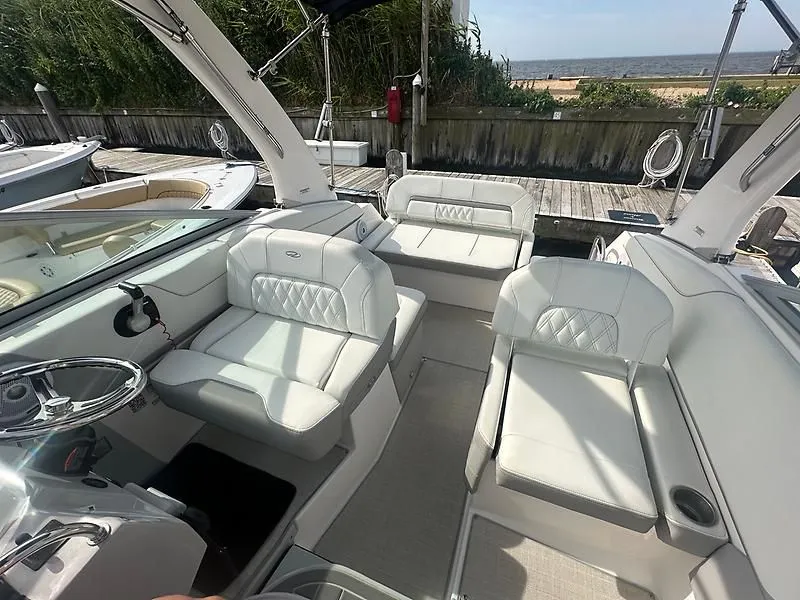 Slide: The Image of Interior of a 2021 Regal 26 XO boat with white leather seating. - 13