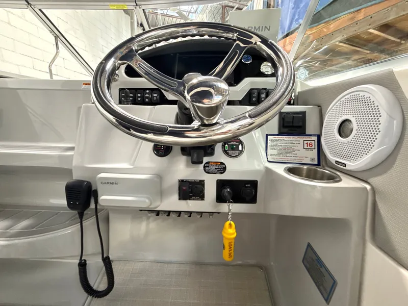 Slide: The Image of Helm console of a 2021 Regal 26 XO boat. - 15