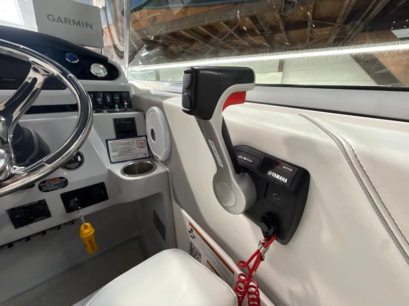Slide: The Image of Interior view of a 2021 Regal 26 XO boat helm. - 16