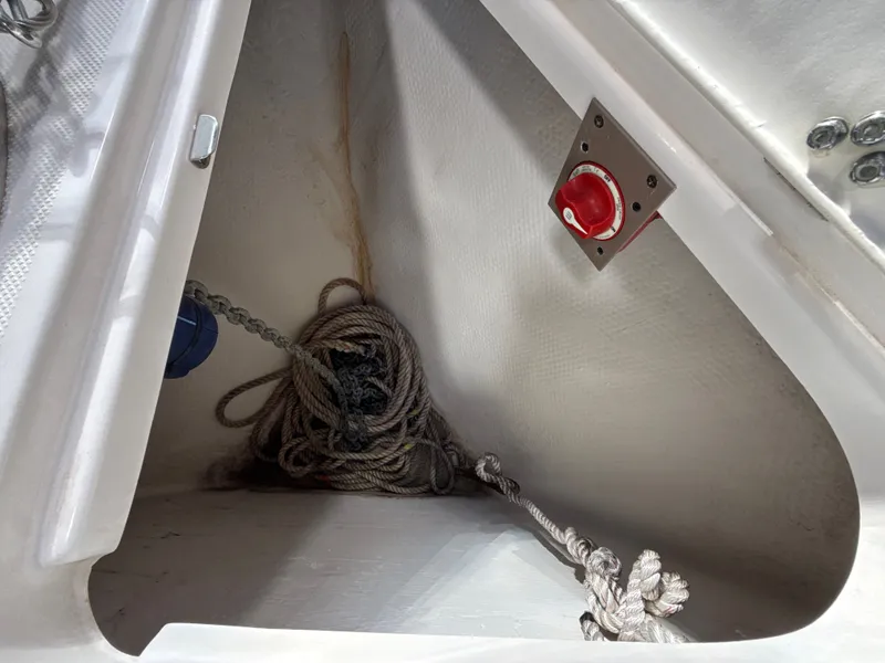 Slide: The Image of Anchor locker of 2021 Regal 26 XO with rope and switch. - 18