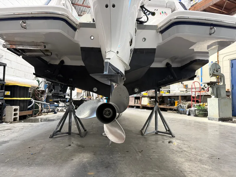 Slide: The Image of Rear view of a 2021 Regal 26 XO boat in a workshop. - 6