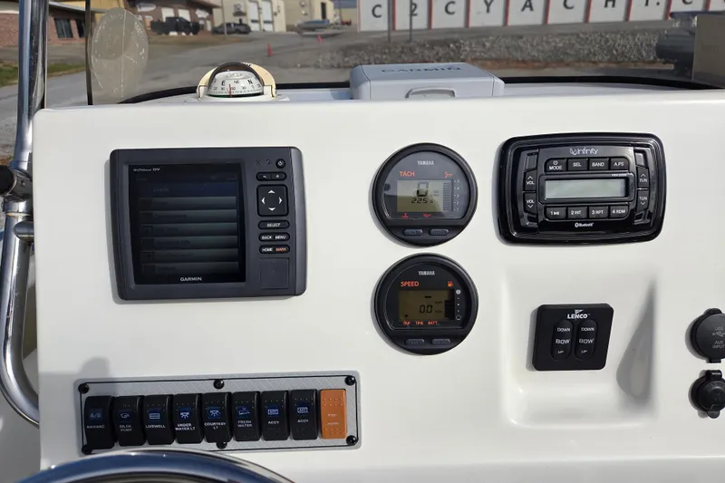 Slide: The Image of Dashboard of a 2015 Key West 203 FS boat with Garmin and Yamaha instruments. - 10