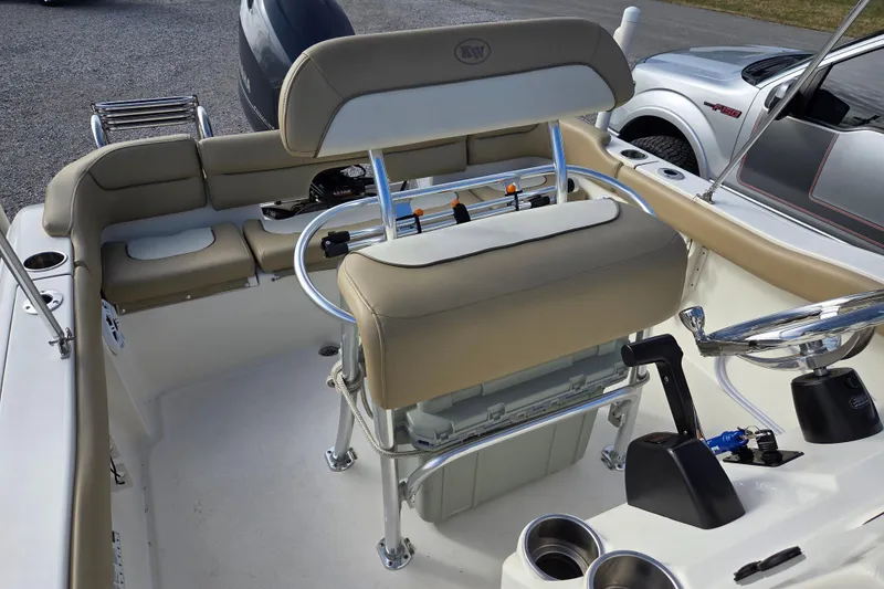 Slide: The Image of 2015 Key West 203 FS boat interior with seating and steering console. - 11