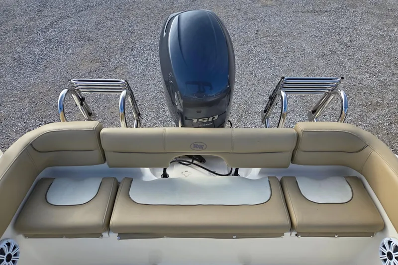 Slide: The Image of 2015 Key West 203 FS boat with Yamaha 150 engine and beige seating. - 13