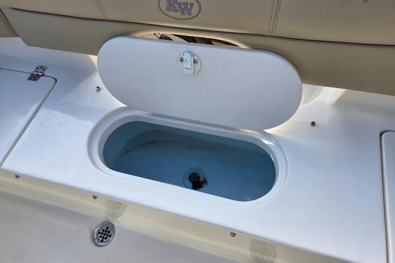 Slide: The Image of 2015 Key West 203 FS boat livewell with open lid, showcasing interior. - 14