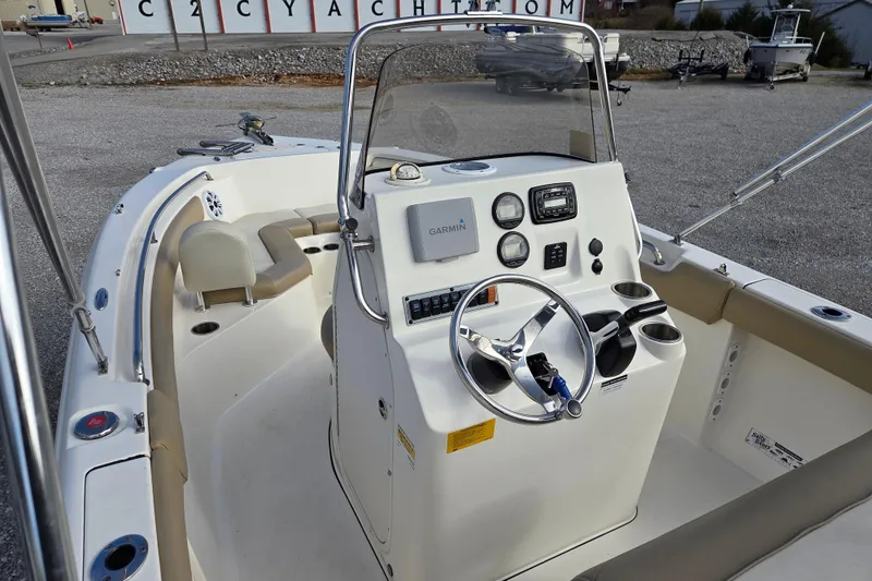 Slide: The Image of 2015 Key West 203 FS boat interior with steering console and seating. - 8