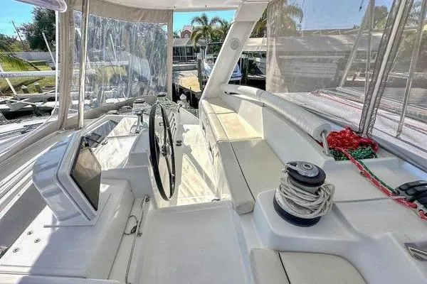 Slide: The Image of Cockpit of 2006 Lagoon 440 catamaran with steering wheel and navigation equipment. - 19