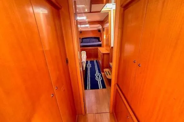 Slide: The Image of Interior of 2006 Lagoon 440 yacht with wooden finish and cozy cabin. - 25