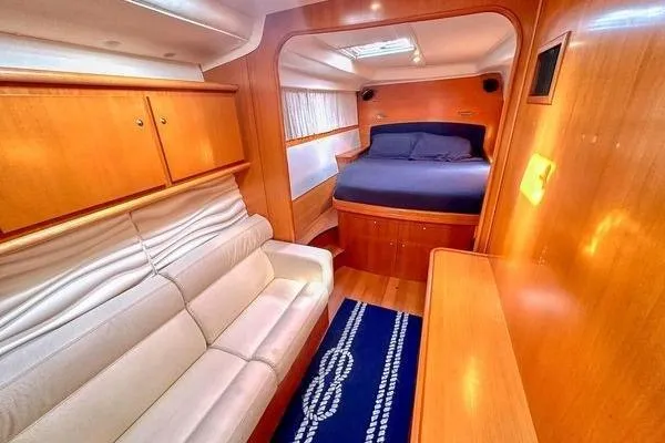 Slide: The Image of Luxurious interior of 2006 Lagoon 440 yacht with cozy bed and elegant seating area. - 26