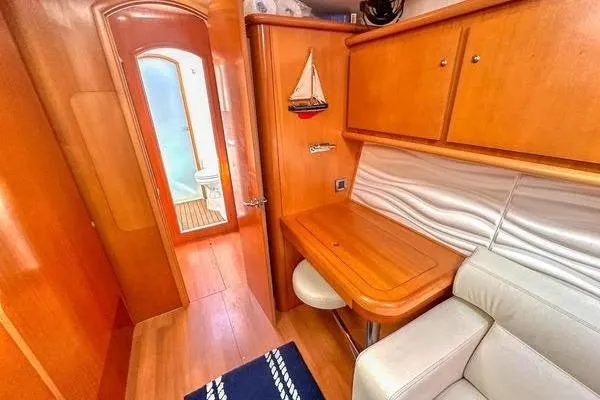 Slide: The Image of Interior of 2006 Lagoon 440 yacht with wooden cabinetry and seating area. - 29