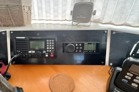 Slide: The Image of Boat radio and control panel inside a 2006 Lagoon 440 catamaran. - 35