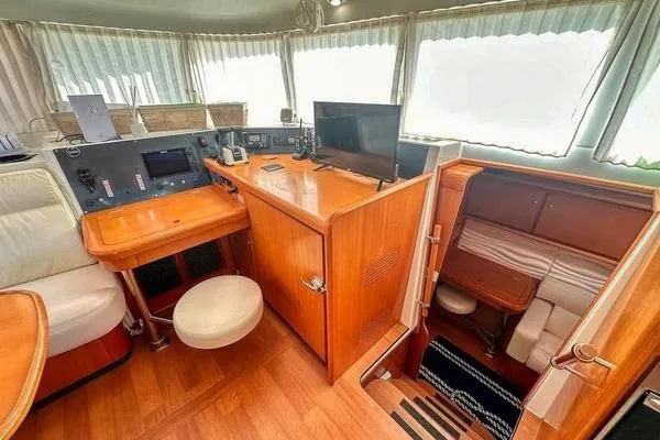 Slide: The Image of Interior of 2006 Lagoon 440 yacht with navigation station and cozy cabin. - 39