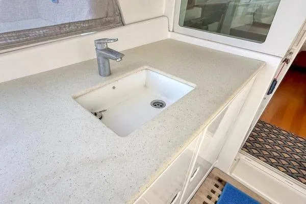 Slide: The Image of Modern kitchen sink on 2006 Lagoon 440 yacht with sleek countertop design. - 46