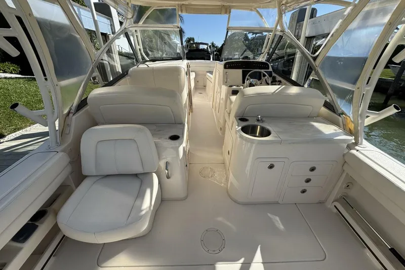 Slide: The Image of 2016 Grady-White Freedom 307 boat interior with seating and helm station. - 16