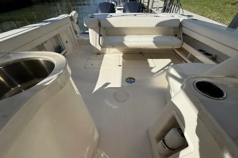 Slide: The Image of 2016 Grady-White Freedom 307 boat interior with seating and amenities. - 19