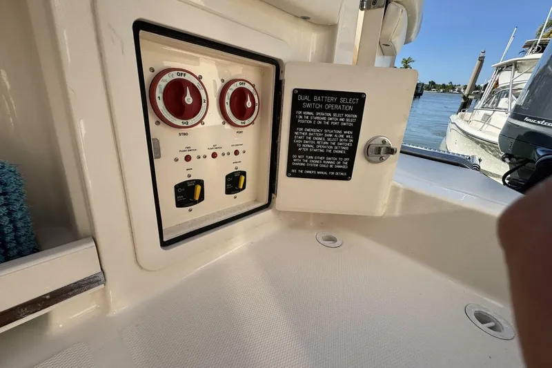 Slide: The Image of 2016 Grady-White Freedom 307 boat battery switch panel by the water. - 29