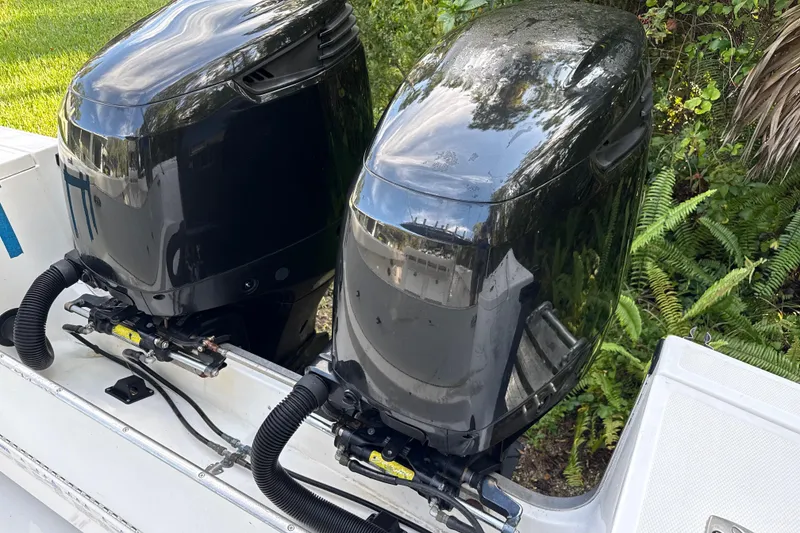 Slide: The Image of Twin outboard motors on a 2002 SeaCraft SC32 Master Angler boat. - 11