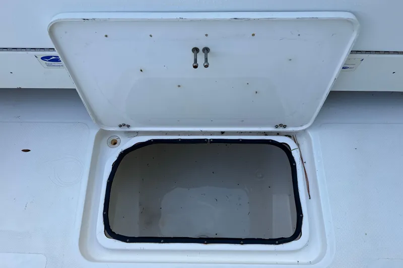 Slide: The Image of Open storage compartment on 2002 SeaCraft SC32 Master Angler boat. - 16