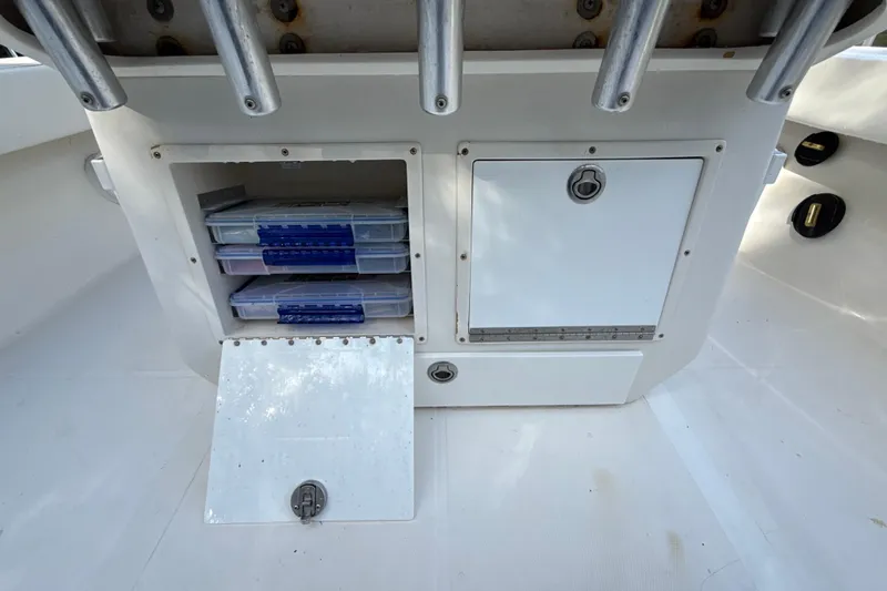 Slide: The Image of Storage compartment on a 2002 SeaCraft SC32 Master Angler boat with tackle boxes. - 20