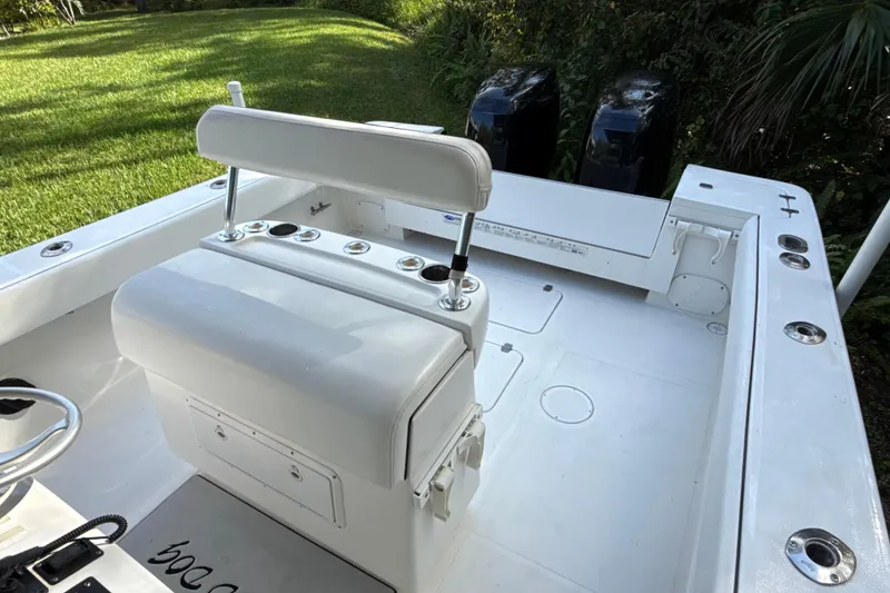 Slide: The Image of 2002 SeaCraft SC32 Master Angler boat interior with seating and dual engines. - 23