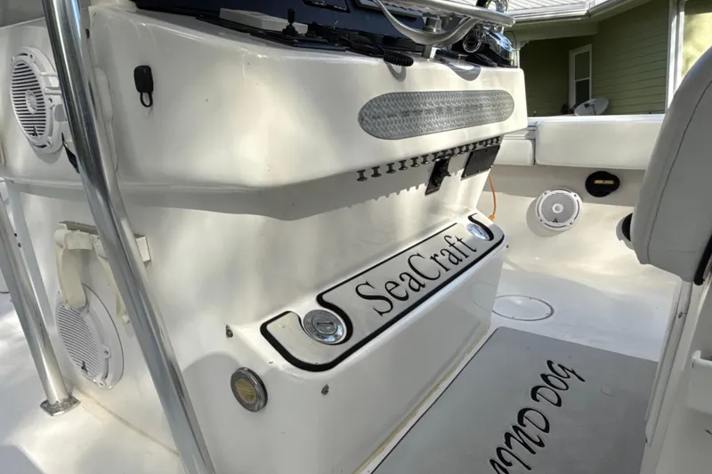 Slide: The Image of 2002 SeaCraft SC32 Master Angler boat interior with speakers and branded mat. - 30