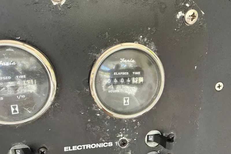 Slide: The Image of Close-up of Faria elapsed time gauges on 2002 SeaCraft SC32 Master Angler boat. - 37