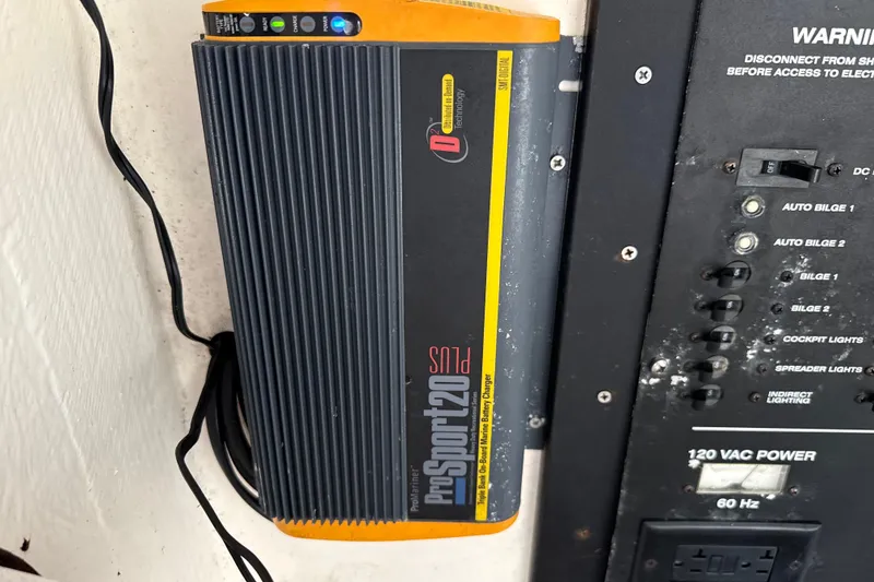 Slide: The Image of Onboard battery charger and control panel in a 2002 SeaCraft SC32 Master Angler boat. - 38