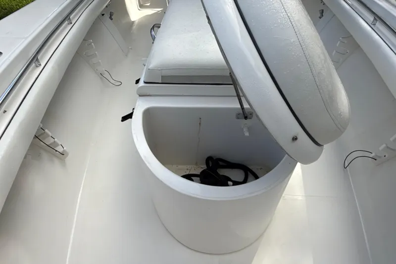 Slide: The Image of 2002 SeaCraft SC32 Master Angler boat interior with open storage compartment. - 47