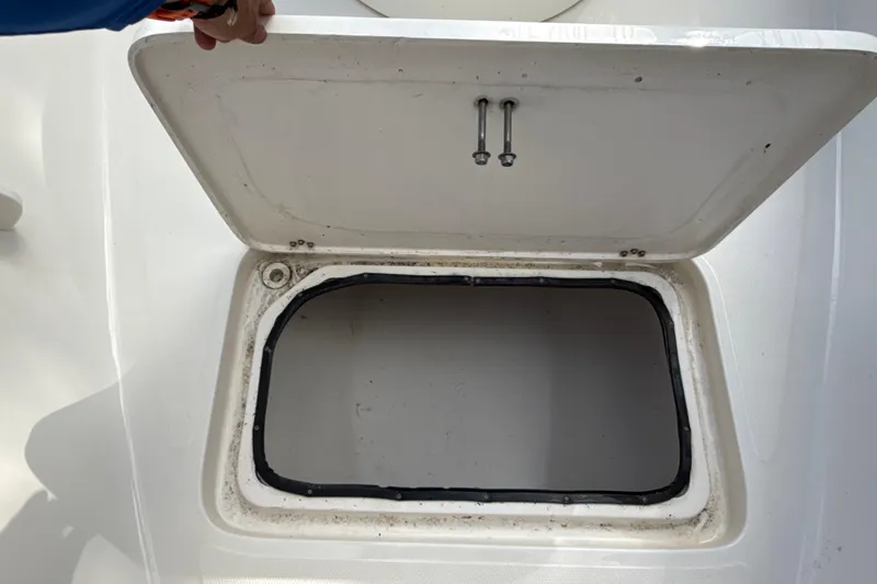 Slide: The Image of Open storage compartment on 2002 SeaCraft SC32 Master Angler boat. - 49